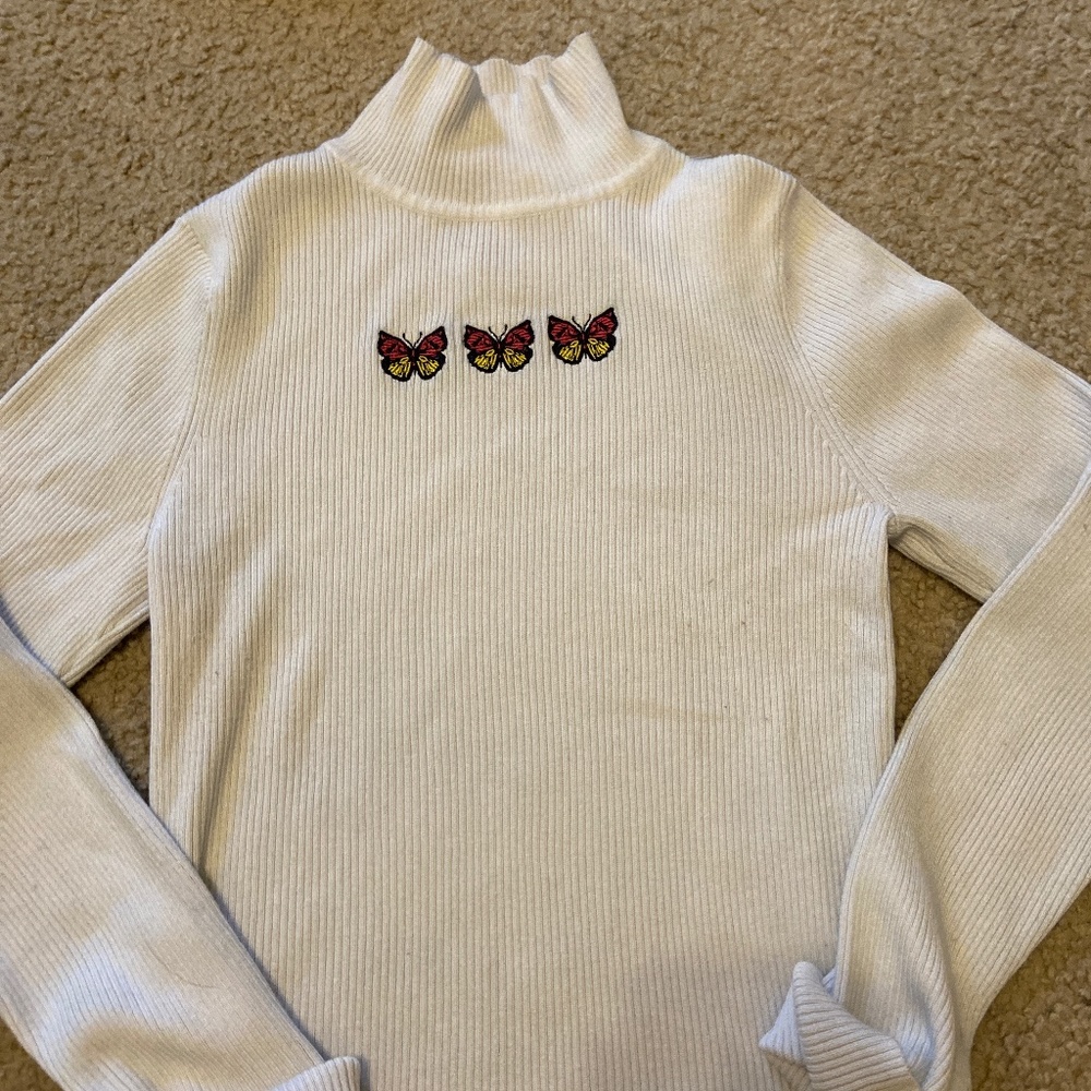 White embroidered butterfly turtleneck